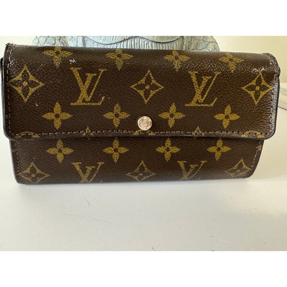 Special edition Louis Vuitton Sara wallet.  Has been repaired.